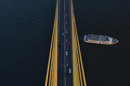 Aerial view Road, The expressway across the river has many cars in Thailand. Beautiful Street , Top view Backgroundの写真素材
