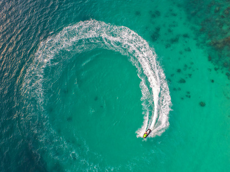 People are playing a jet ski in the seaの写真素材