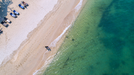 Sea Aerial view, Top view,amazing nature background.The color of the water and beautifully bright.Azure beach with rocky mountains and clear water of Thailand ocean at sunny day.flying drone,sea viewの写真素材