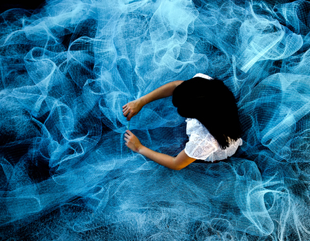 Fishermen are repairing fishing nets.の写真素材