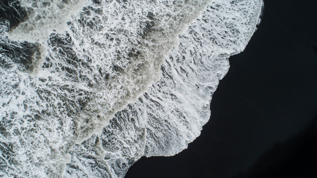 The black sand beach in Iceland. Aerial view and top view. Beautiful natural backdrop.