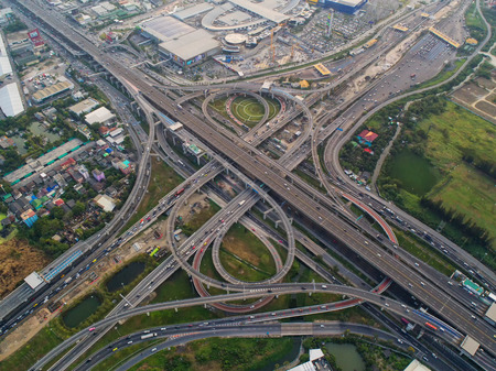 Aerial view, Road roundabout, Expressway with car lots in the city in Thailand.  beautiful Street , downtown, cityscape, Top view. Backgroundの写真素材