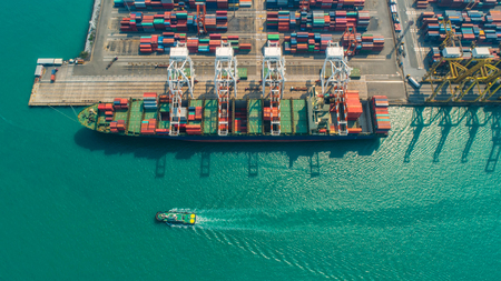 Container ship in export and import business and logistics. Shipping cargo to harbor by crane. Water transport International. Aerial view and top view.のeditorial素材