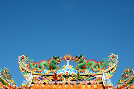 green dragon on the roof with blue sky backgroundの写真素材