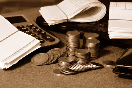 currency and receipts with laptop and calculator for financial concept 