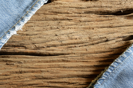 old wooden background with blue jeanの写真素材