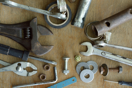 set of old tools on the wooden backgroundの写真素材