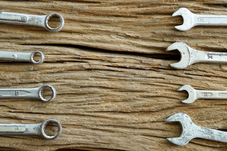 set of old tools on the wooden background, wrenchの写真素材