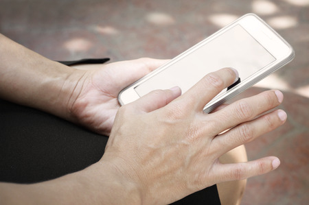 close up of woman using mobile smart phoneの写真素材