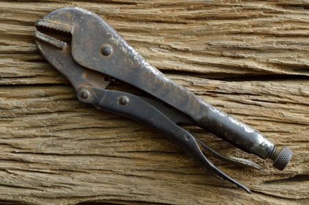 old tools on the wooden background, pliersの写真素材