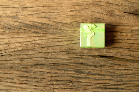green gift box on wooden backgroundの写真素材