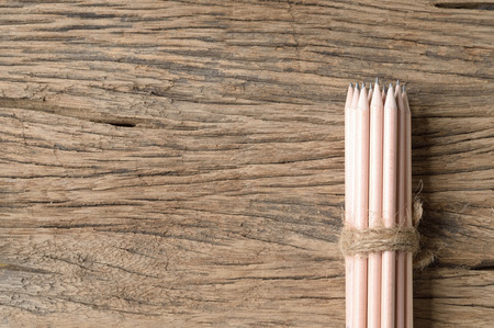 top view of wooden pencil on wood tableの写真素材