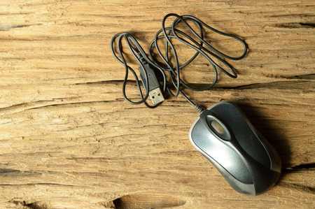 computer mouse on old wooden tableの写真素材