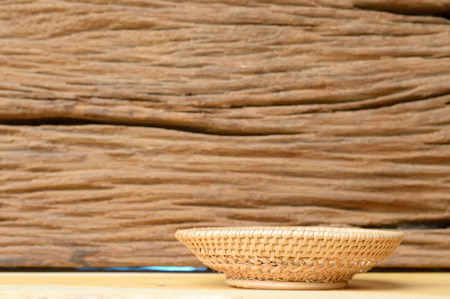 side view of wicker basket on wooden backgroundの写真素材