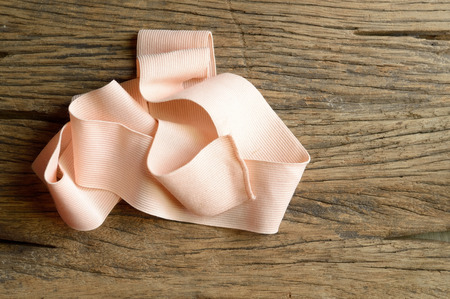 elastic bandage on wooden backgroundの写真素材