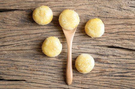 chinese pastry or moon cake in spoon on wooden table, chinese festival dessertの写真素材