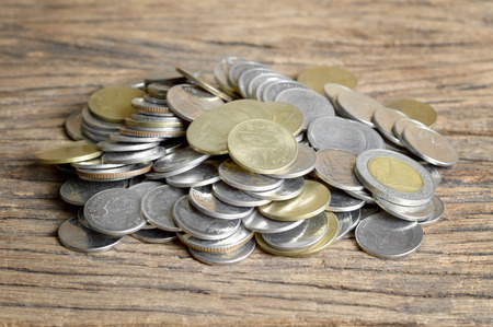 coins on wooden table, thai bahtの写真素材