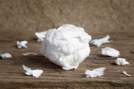 used paper tissue on wooden tableの写真素材