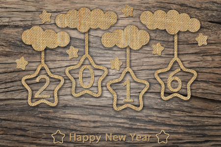 Happy New Year 2016, hanging star and cloud on wood backgroundの写真素材