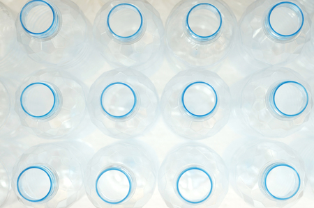 top view of white plastic bottle in the rowの写真素材