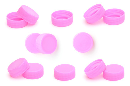 set of pink plastic bottle cap isolated on white backgroundの写真素材
