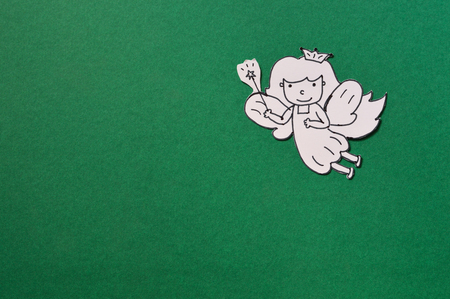 dental paper cut, cute tooth fairy isolated on green backgroundの写真素材