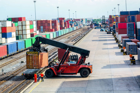 forklift handling container box loading to freight train