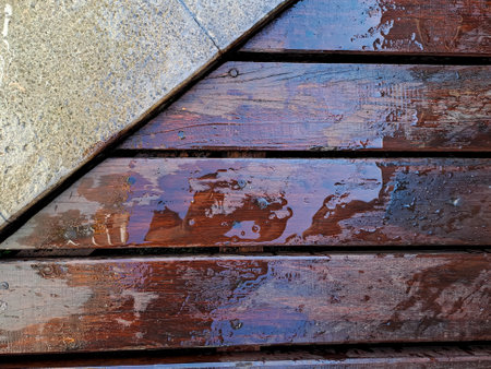 Wet wooden deck or wooden floor of pool side arranged horizontally. Natural wood texture backgroundの写真素材