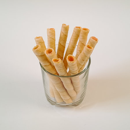 Cheese wafer rolls isolated on white backgroundの写真素材