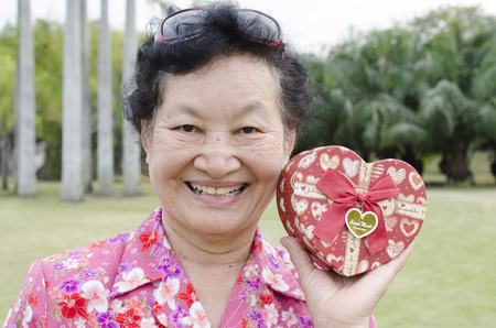Portrait of asian elderly at the parkの写真素材