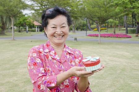 Portrait of asian elderly at the parkの写真素材
