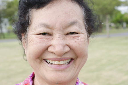 Portrait of asian elderly at the parkの写真素材