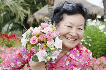 Portrait of asian elderly at the parkの写真素材
