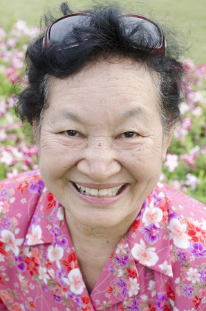 Portrait of asian elderly at the parkの写真素材