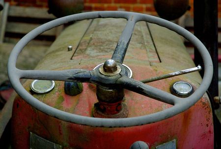 A vintage tractor steering wheelの写真素材