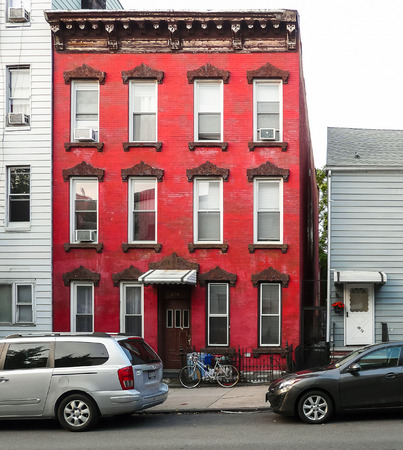 Brooklyn, New York - August 16, 2014: Red front of old brick house at Manhattan Ave in Greenpoint.のeditorial素材