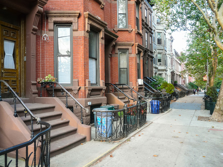 Brooklyn, New York - August 16, 2014: Stairs and portals of residential brick houses at Kent Street in Greenpoint.のeditorial素材