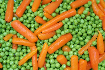 appetizing carrot from green green peasの写真素材