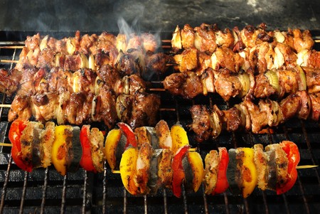 barbecue from meat on metal grillの写真素材