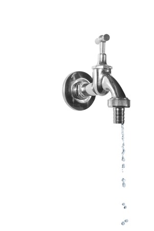 dripping metal tap on white backgroundの写真素材