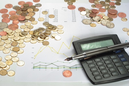 different coins on background of graphs