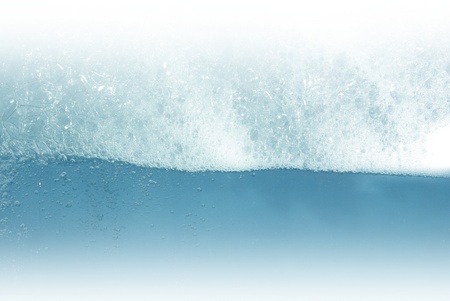foam afloat on white backgroundの写真素材
