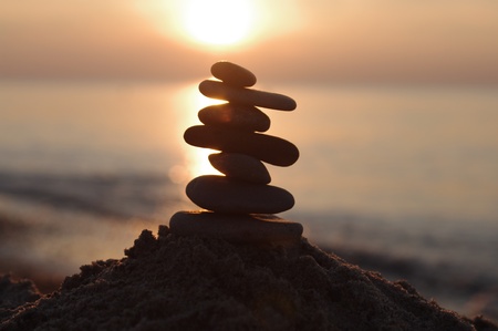 stone in  sand on sunset   backgroundの写真素材