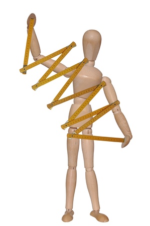 standing  wooden dummy with measure on white backgroundの写真素材