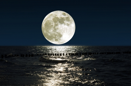 moon and his reflection in waterの写真素材