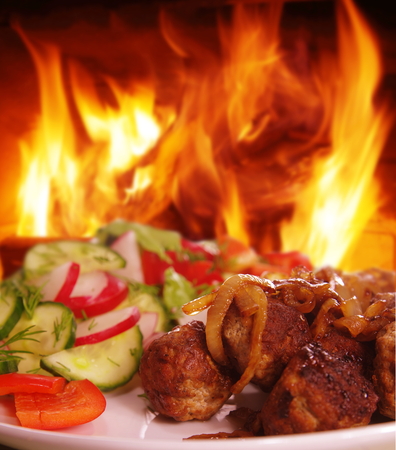 steak with  vegetable on fire backgroundの写真素材