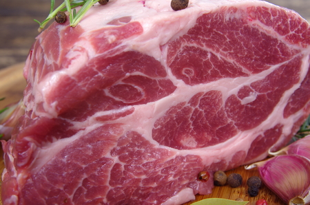 neck with rosemary and basil on chopping boardの写真素材