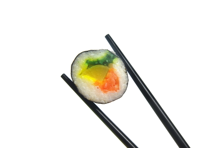 portion sushi and black hopsticks isolated on a white backgroundの写真素材