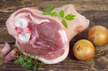 raw knuckle of pork on wooden board,の写真素材