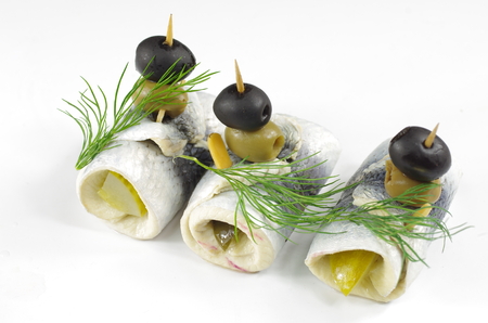 appetizing rollmop with onion and dillの写真素材